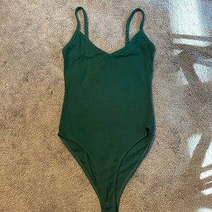 Dark green body suit.